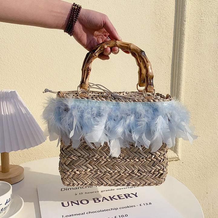 Elegant handbag with feathers and bamboo handles Kalsten