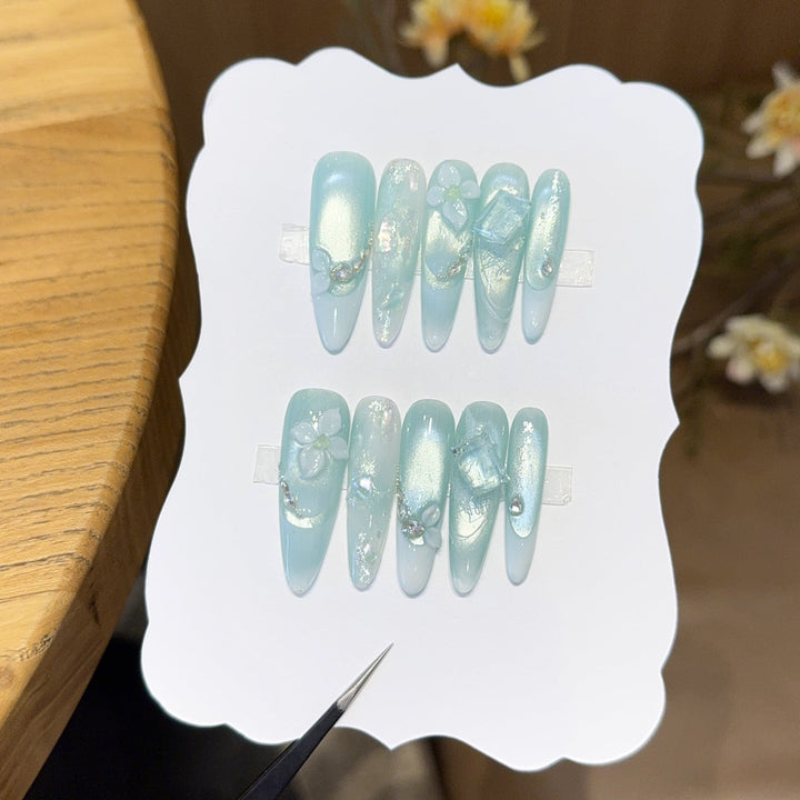Artificial nails with floral designs and glitter effects Kalsten