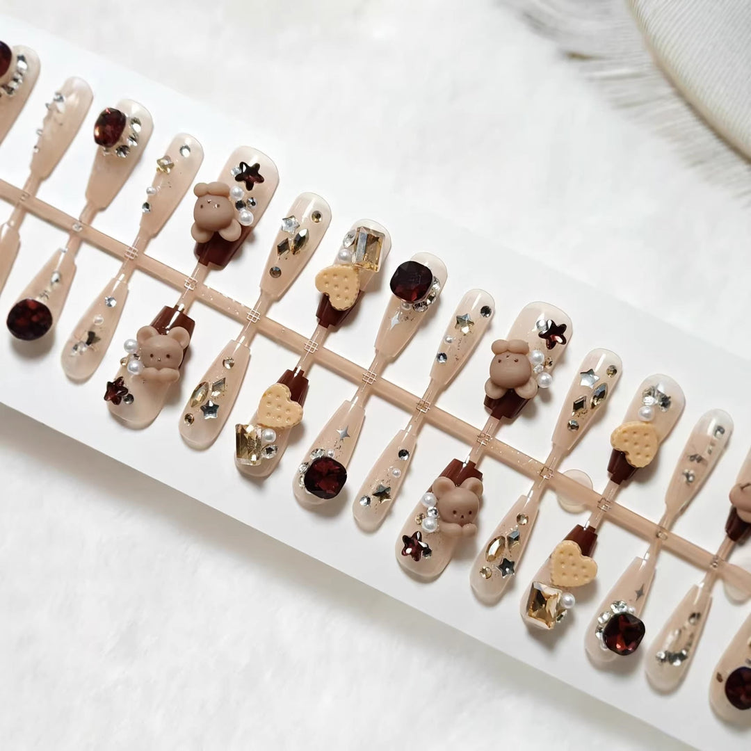 Creative acrylic nails with animal motifs and glitter accents Kalsten