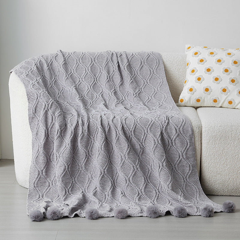 Ladies knit blanket with decorative pom poms Kalsten