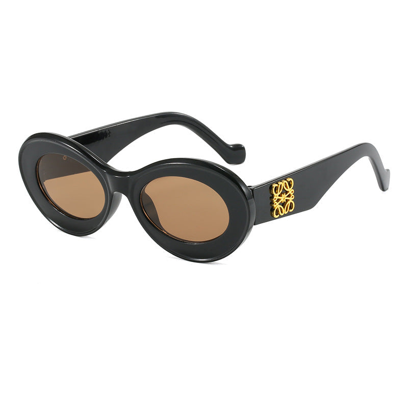 Women's fashionable sunglasses with oval frame and golden applications Kalsten