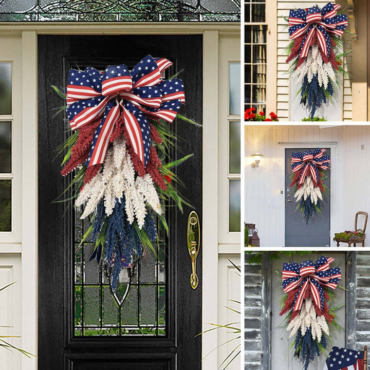 Independence Day tapering teardrop door swag with wired stars-and-stripes bow and textured faux floral sprays Kalsten