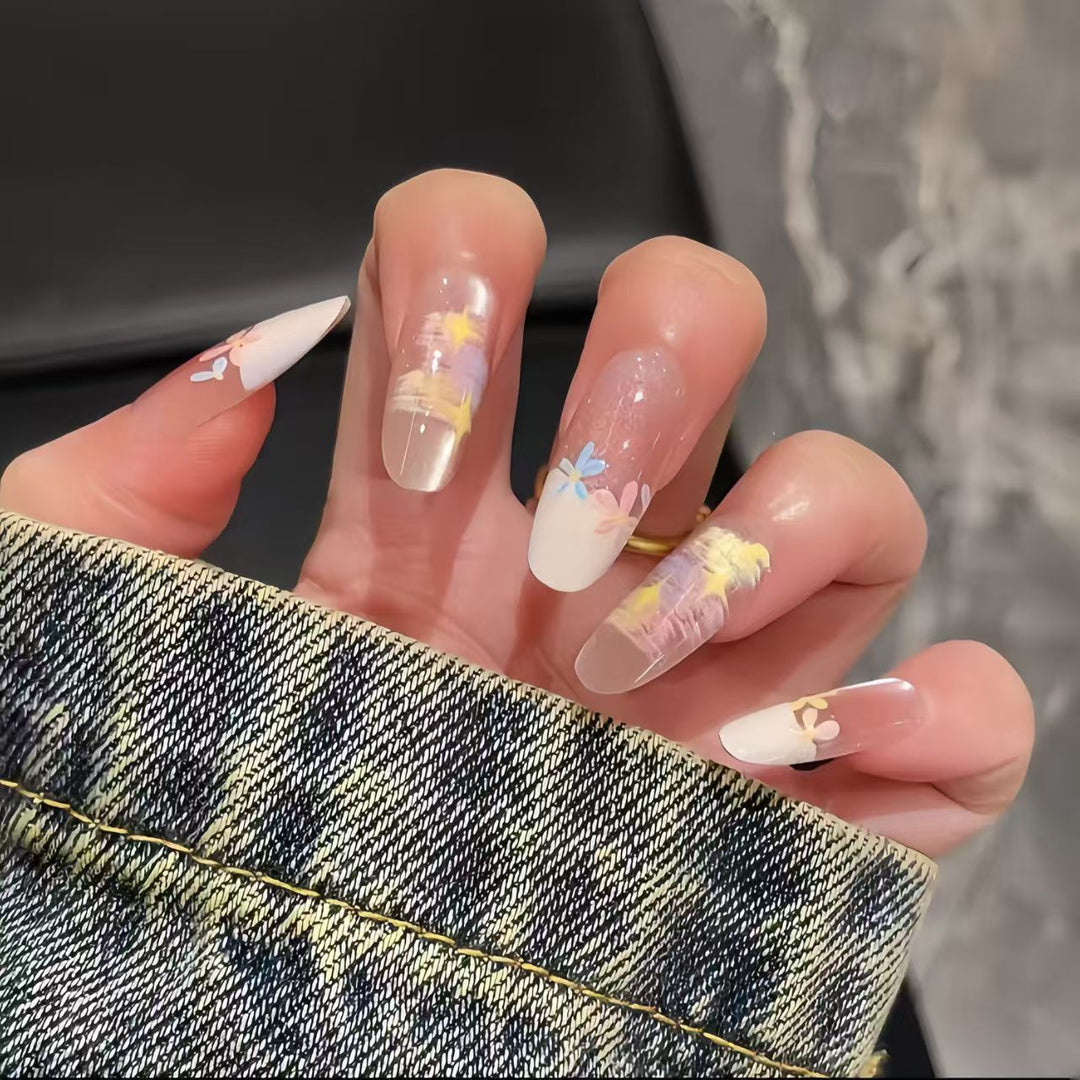 Artificial nails with delicate floral accents and glitter effects Kalsten