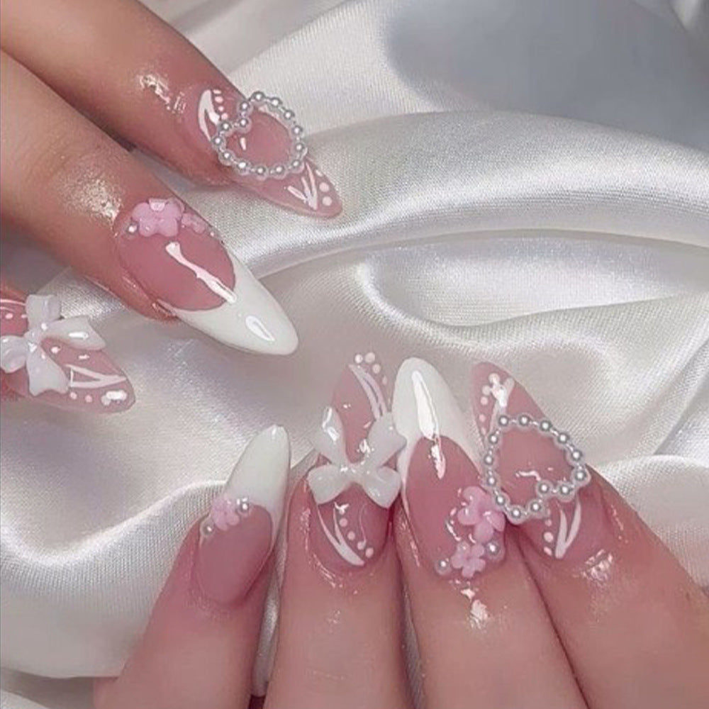 Artificial nails in a playful flower design with glittering accents Acalora