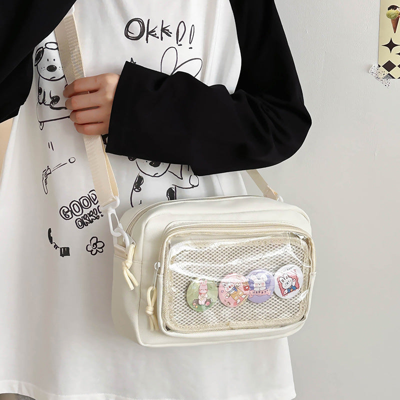 Shoulder bag with transparent viewing pocket and playful graphic design Kalsten
