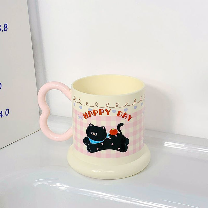 Ceramic mug with playful puppy motif Kalsten
