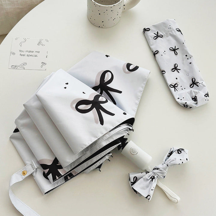 Women’s Folding Umbrella with Playful Bow Pattern Kalsten
