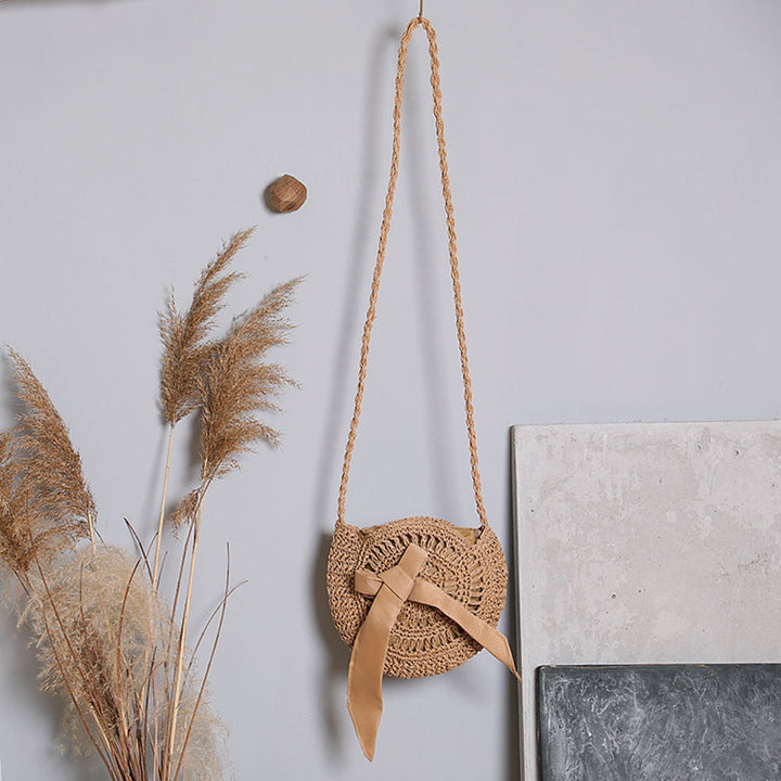 Handwoven shoulder bag with decorative bow accent Kalsten
