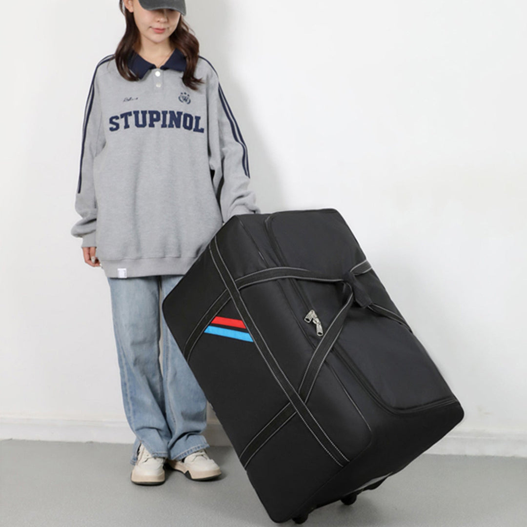 Spacious travel bag with lightweight wheels and reinforced carrying handle Kalsten