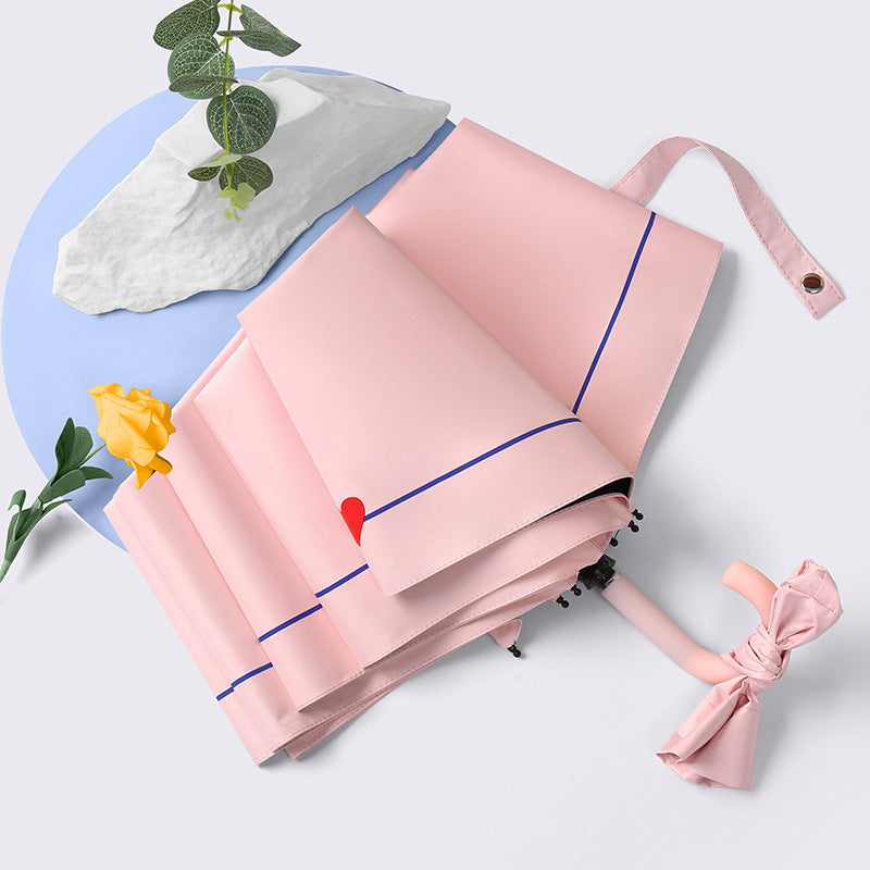 Ladies elegant folding umbrella with ergonomic wooden handle and protective carrying case Kalsten