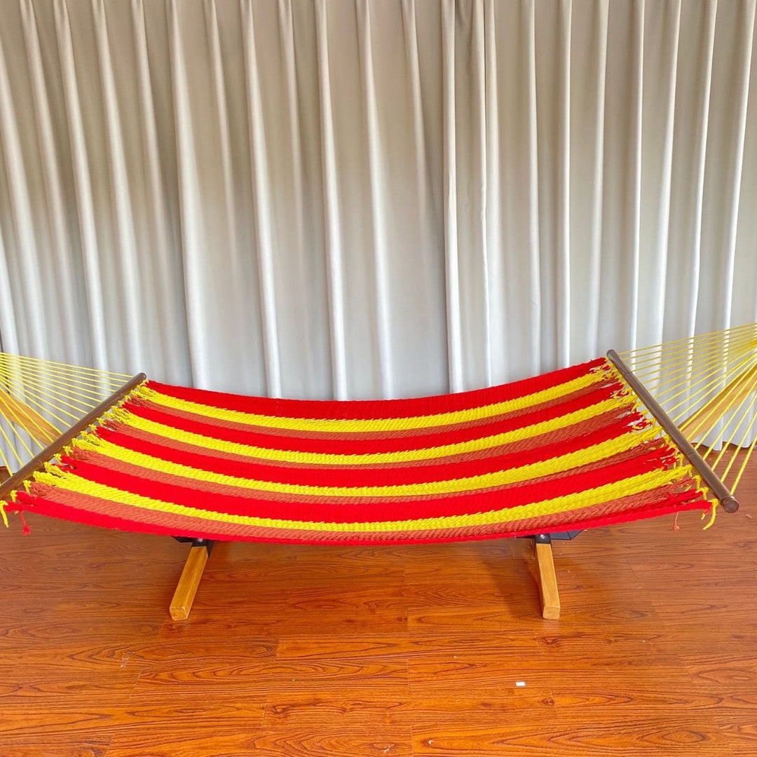 Woven cotton hammock with wooden spreader bars and freestanding stand Kalsten