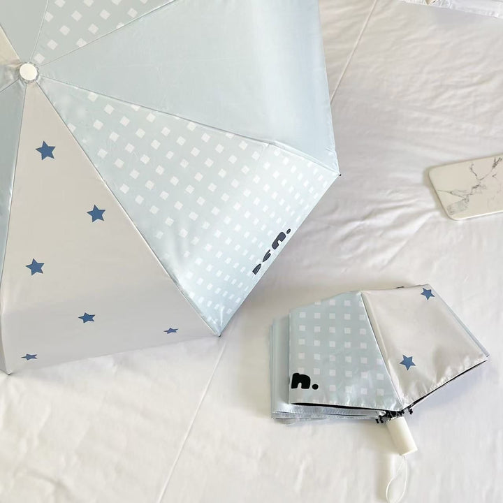 Women's folding umbrella with unique star pattern and practical carrying bag Kalsten