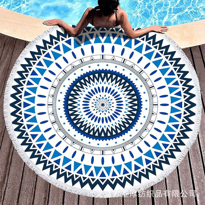 Round beach towel with colorful, tropical floral pattern and fringe decoration Kalsten