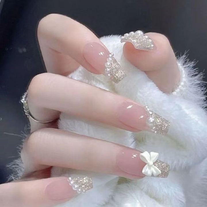 Glamorous artificial nails with delicate flower and glitter effects Kalsten