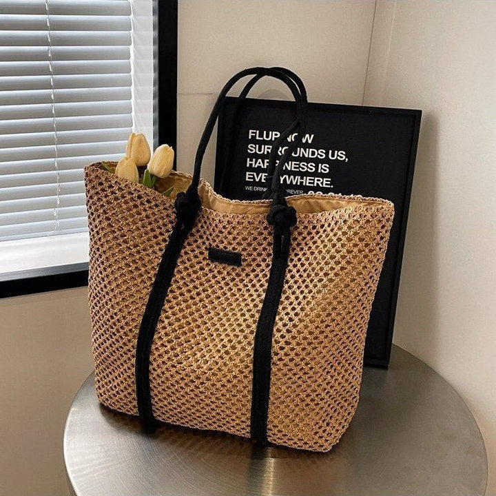 Beach bag made of hand-woven natural material with sturdy handles Kalsten