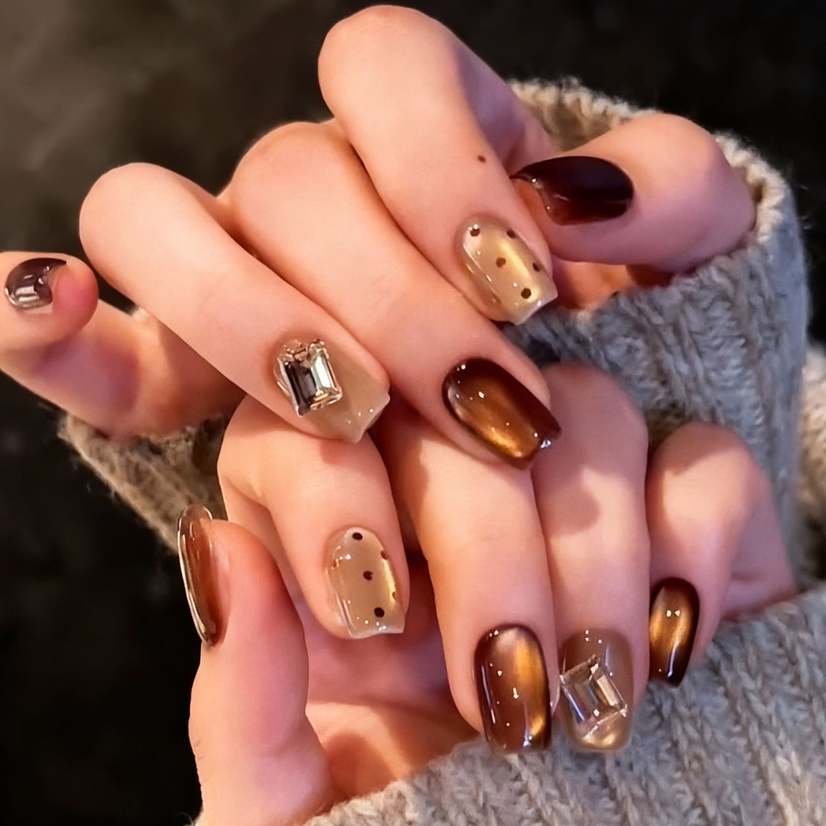 Acrylic nail set with elegant ombre designs and sparkling accents Acalora