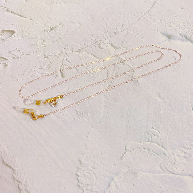 Eyewear chain with pearls and gold pendants Kalsten