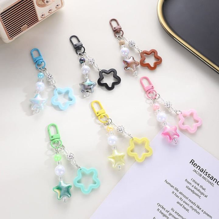 Playful keychain with floral and star motif Kalsten