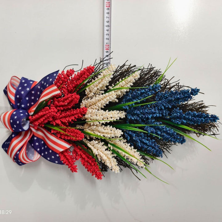 Independence Day tiered faux wildflower door swag with grosgrain stars-and-stripes bow Kalsten