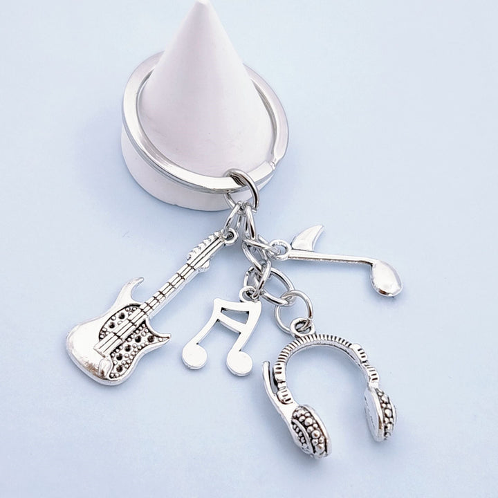 Keychain with musical instruments motifs Kalsten