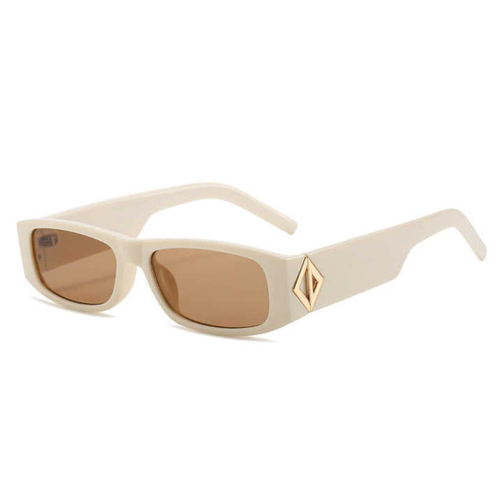 Ladies fashionable sunglasses with asymmetrical frame and gold-colored details Kalsten