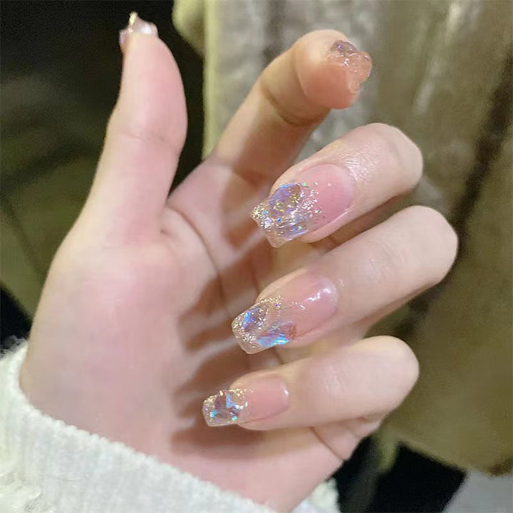 Glamorous artificial nails with heart design and glittering accents Kalsten