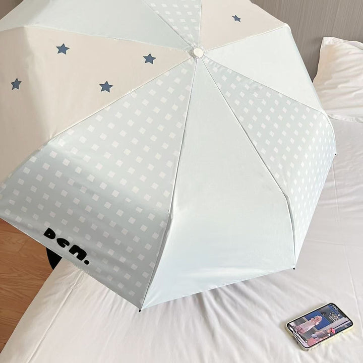 Women's folding umbrella with unique star pattern and practical carrying bag Kalsten