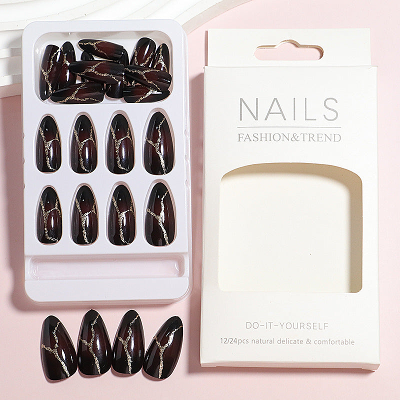 Artistic Press-On Nail Design with Gold Veining Accents Kalsten