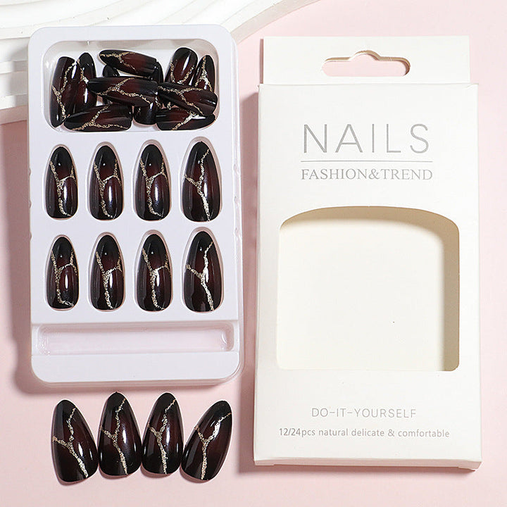 Artistic Press-On Nail Design with Gold Veining Accents Kalsten