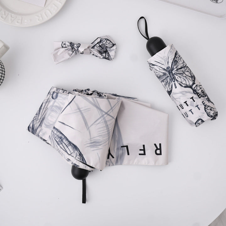 Women's fashionable folding umbrella with playful design Kalsten