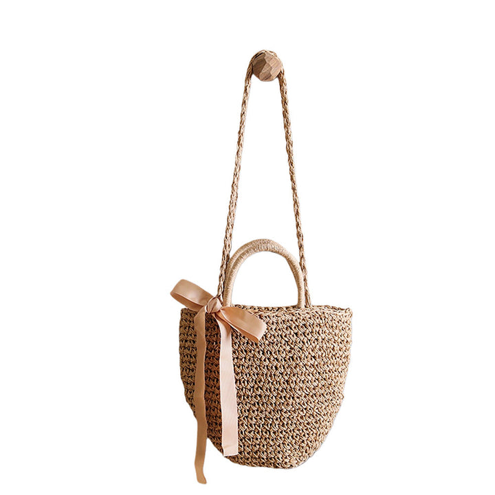 Basket bag with stylish carrying handles and decorative bow Kalsten