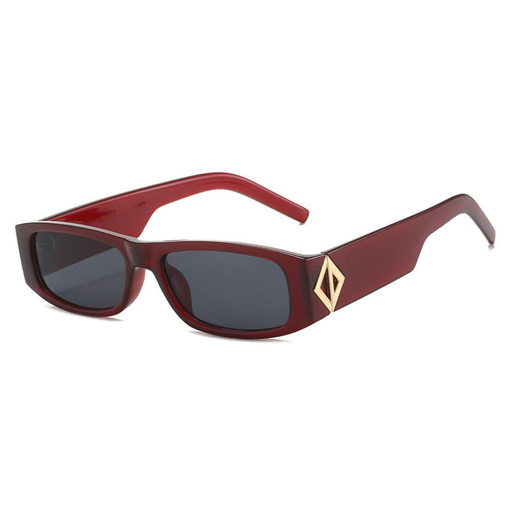 Ladies fashionable sunglasses with asymmetrical frame and gold-colored details Kalsten