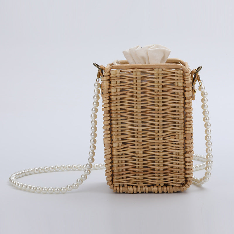 Women's handbag made of woven material with pearl accents Kalsten
