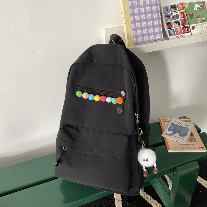 Practical backpack with colorful applications Kalsten
