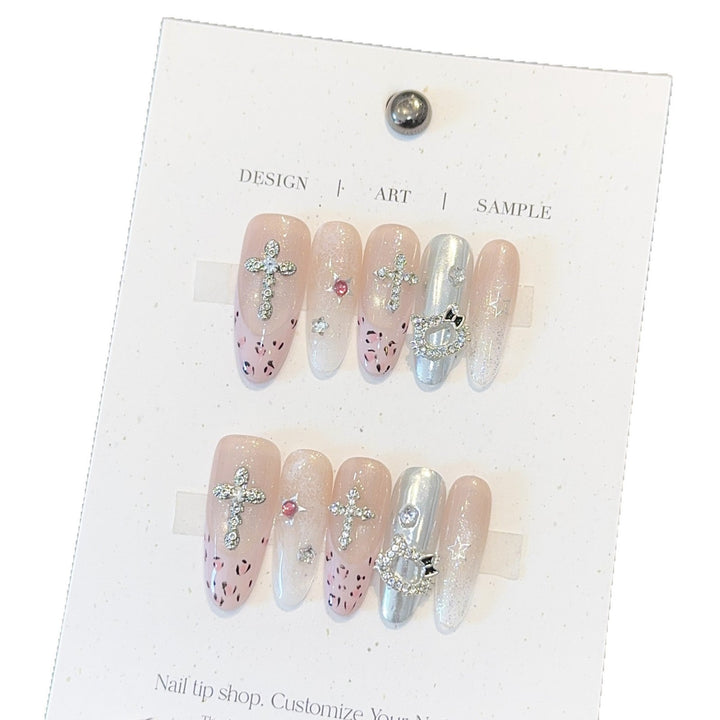 Artificial nails with sparkling rhinestones and cross motifs Kalsten
