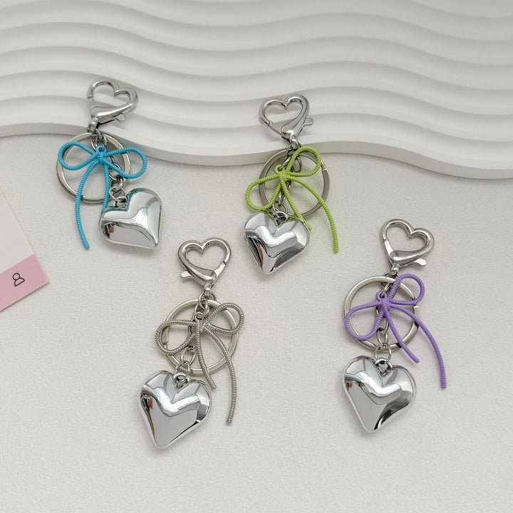 Heart-Shaped Metallic Keychain with Decorative Bow Kalsten