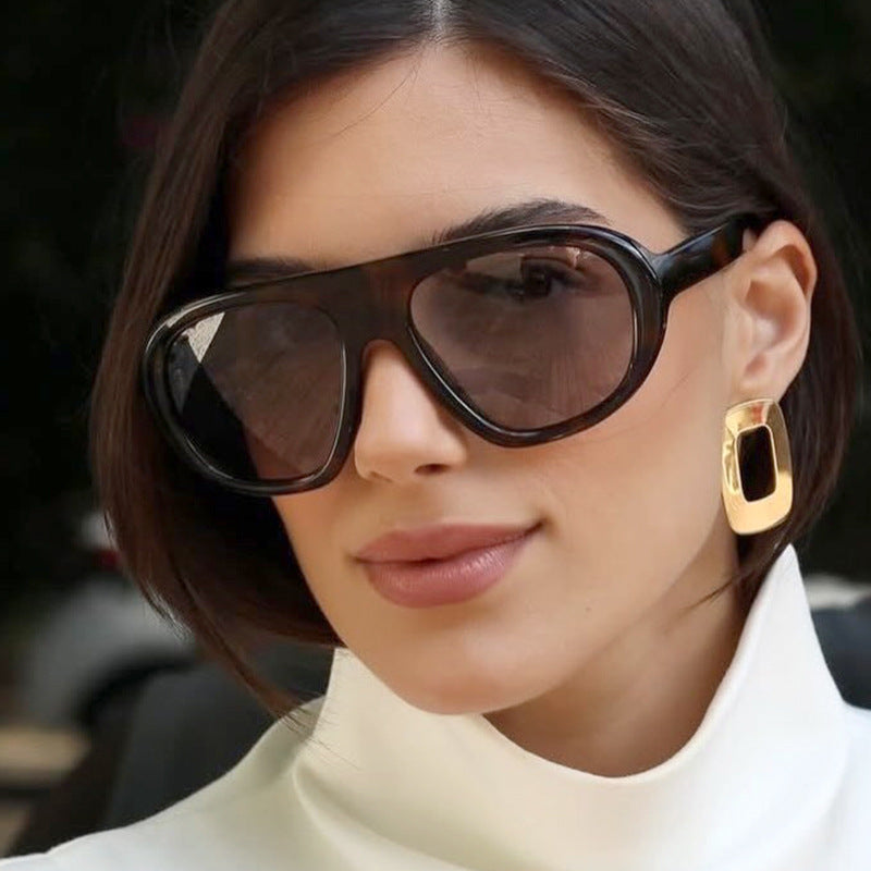 Women striking sunglasses with futuristic frame and sturdy design Kalsten