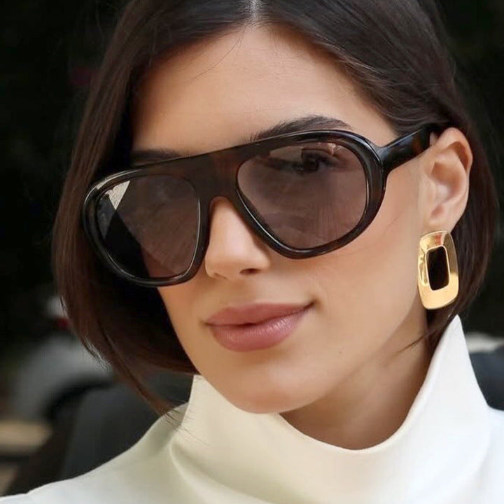 Women striking sunglasses with futuristic frame and sturdy design Kalsten