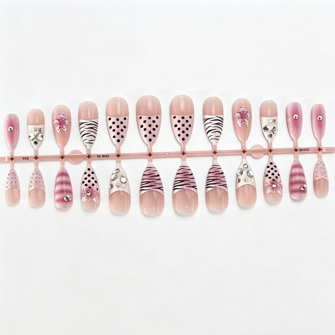 Artistic Press-On Nail Design with Unique Patterns and Rhinestone Accents Kalsten