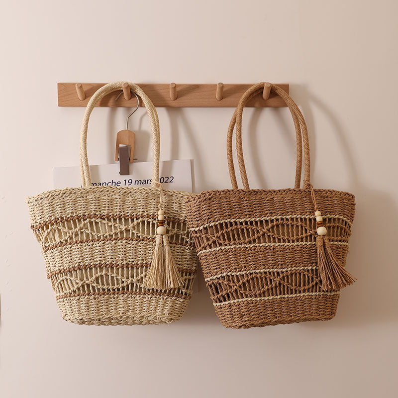 Handcrafted straw tote bag with decorative tassel detail Kalsten