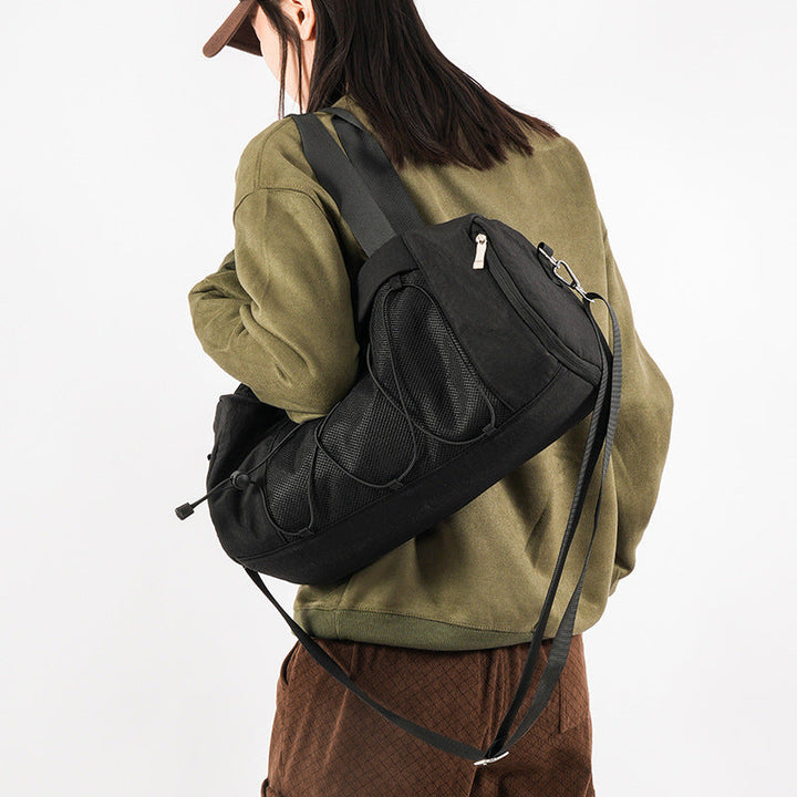 Sporty shoulder bag with adjustable carrying handles and breathable mesh material Kalsten