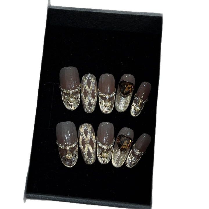 Glamorous artificial nails with glitter and heart design Kalsten