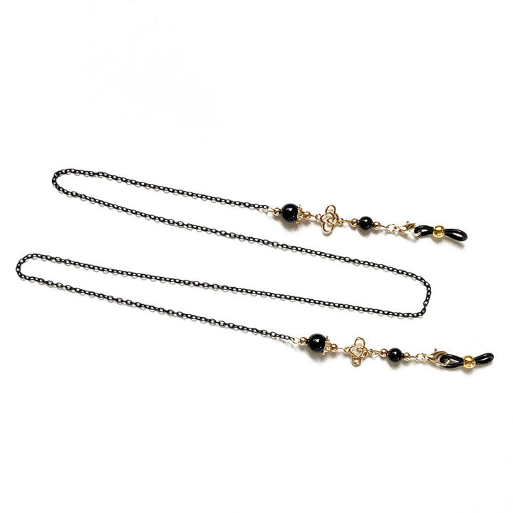Filigree glasses chain holder with pearls and golden accents Kalsten
