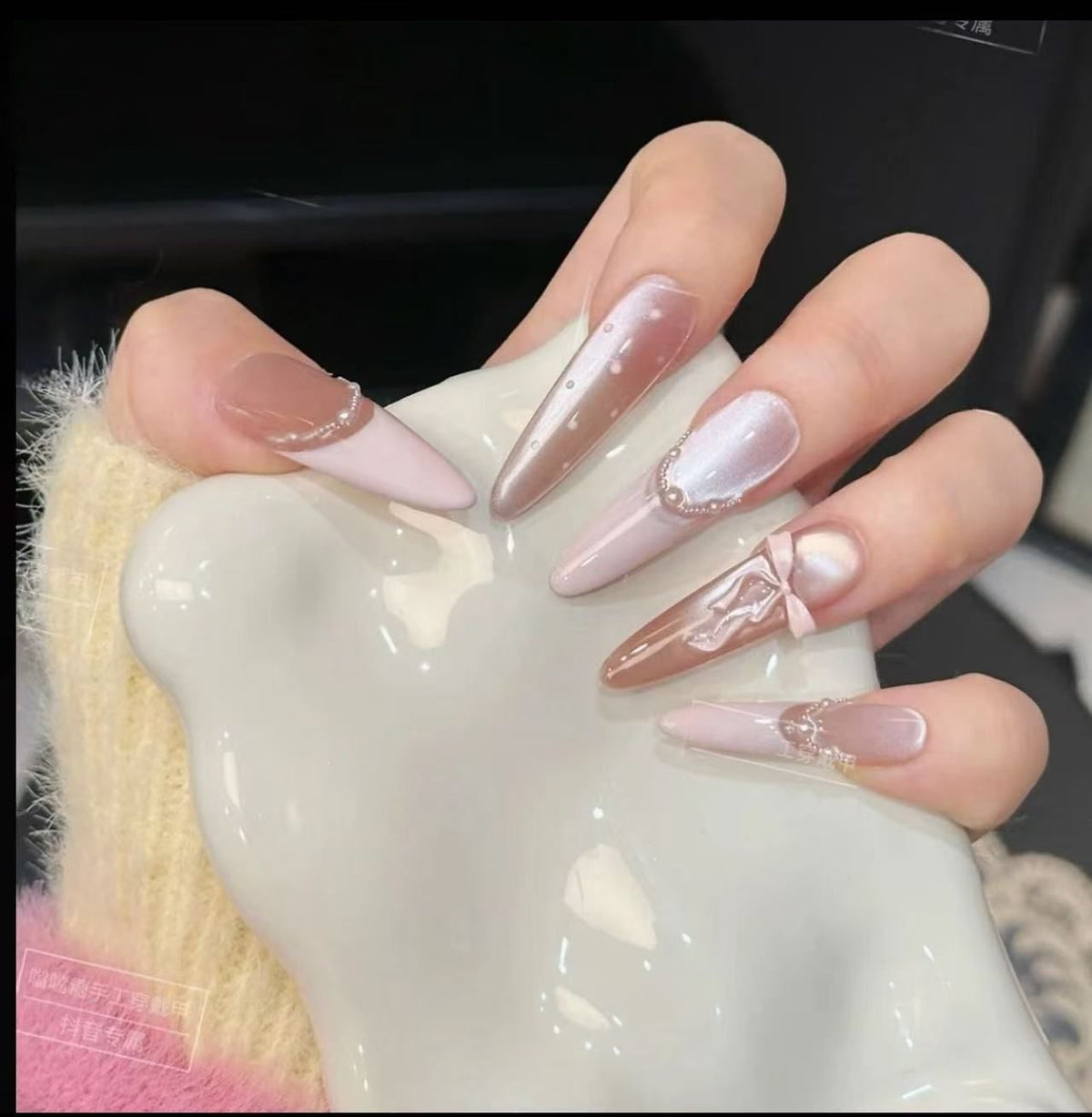 Acrylic nail set with elegant tips and glamorous rhinestone accents Acalora