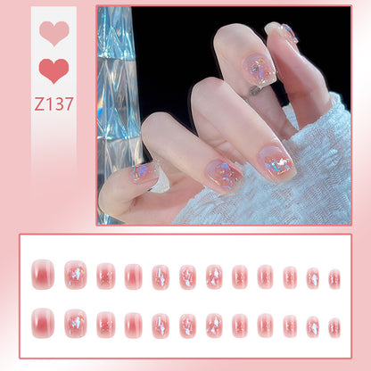 Nail art set with elegant wave patterns and delicate pearl accents Acalora