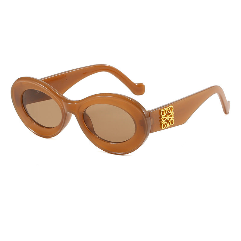 Women's fashionable sunglasses with oval frame and golden applications Kalsten