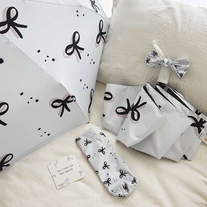 Women’s Folding Umbrella with Playful Bow Pattern Kalsten