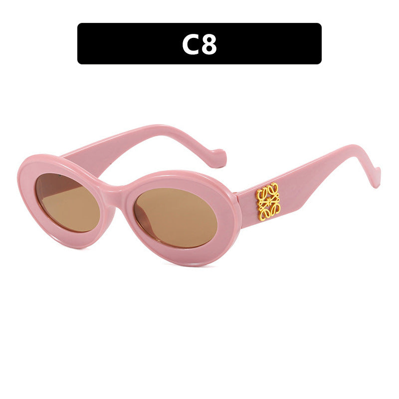 Women's fashionable sunglasses with oval frame and golden accents Kalsten