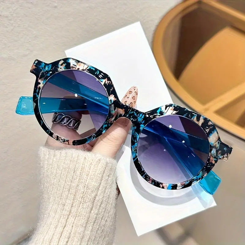 Ladies extravagant round sunglasses with colored accented frame Kalsten