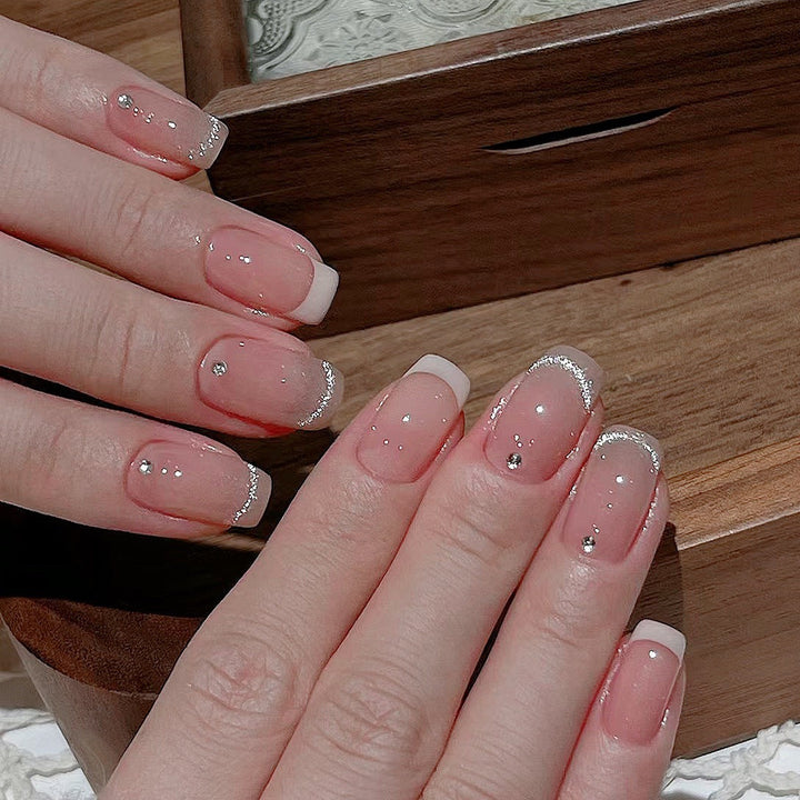 Glamorous artificial nails with filigree rhinestone details Kalsten